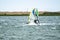 Man windsurfing close to the town of Caernarfon in Wales - United Kingdom