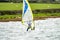 Man windsurfing close to the town of Caernarfon in Wales - United Kingdom