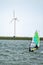 Man windsurfing close to the town of Caernarfon in Wales - United Kingdom