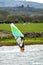 Man windsurfing close to the town of Caernarfon in Wales - United Kingdom