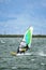 Man windsurfing close to the town of Caernarfon in Wales - United Kingdom