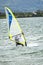 Man windsurfing close to the town of Caernarfon in Wales - United Kingdom