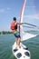 Man windsurfing on lake