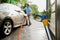 Man wipes a car with rag, hand auto wash station