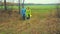 A man and a woman are agronomists in a raincoat returning from the field