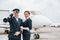 Man with woman. Aircraft crew in work uniform is together outdoors near plane