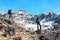 Man and Woman in Alpine Climbers clothing and Gear staying