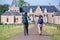 Man and woman with backpacks walking to castle