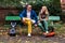 Man and woman on a bench with hoverboards