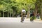 Man and woman biking in the Vondelpark.