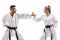 Man and woman with black belts practicing karate