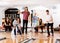 Man And Woman Bowling With Friends in Background