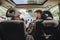 man with woman in car using phone for navigation