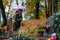 Man and woman on a cemetery with flowers