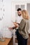 Man and woman chat over a photo copier