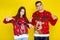Man and woman in christmas sweaters
