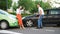 A man and a woman at the colliding cars argue who is to blame for the car accident.