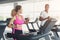 Man and woman, couple in gym on treadmills