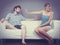 Man and woman in disagreement sitting on sofa