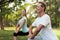 Man and woman doing warm-up in nature. Couple doing sports in nature.