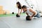 Man And Woman Doing Workout At Cross-Training Gym