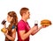 Man and woman eating big sandwich with cola. Isolated.