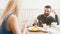 Man and woman eating desserts in a cafe, romantic rendezvous