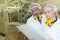 Man and woman in factory looking at paperwork