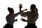 Man and woman fighting at Aikido training in martial arts school