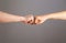 Man and woman are fist bumping. Fist Bump. Clash of two fists, vs. Gesture of giving respect or approval. Friends