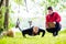 Man and woman at fitness training doing push-ups