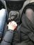 Man and woman, girl, couple in love hold hands with hands clasped with handsome manicure in a car with a mechanical