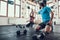 Man And Woman Giving High Five In Fitness Club