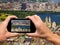 Man and woman hand capturing New York aerial skyline with smartp