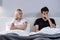 Man and woman having arguments and sexual problems in bed. Portrait of unhappy couple