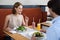 Man and woman having lunch at cafe