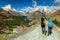 Man and woman hikers trekking in mountains,Valais,Zermatt,Switzerland