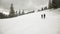 Man and Woman hiking in winter mountains