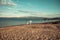 Man and woman hold hands, couple happy on vacation. Couple in love stand on beach, seashore. Honeymoon, just married