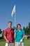 Man and Woman Holding Golf Pin - Vertical