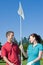 Man and Woman Holding Golf Pin - Vertical