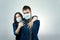 Man and woman kisses each other at protected face mask, protection against the virus. Pandemic. Corona virus