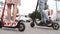 Man and woman legs ride future technology electric scooters