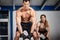 Man and woman lifting kettle bell crossfit