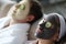 Man and woman make rejuvenating clay mask to restore facial skin