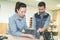 Man and woman making marble funeral plaques