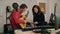 Man and woman musicians composing song at music studio