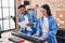 Man and woman musicians singing song playing piano at music studio