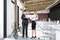 Man and woman in office with a poster and a bike