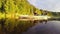 Man and woman paddling canoe synchronously on beautiful river